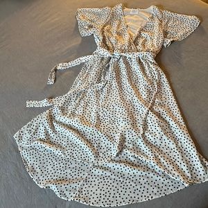 Black and white polka dot faux wrap dress